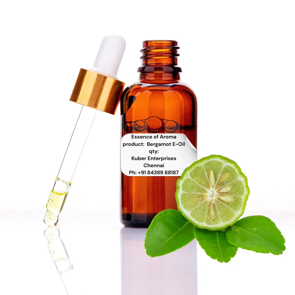 Bottle of Bergamot E-Oil with dropper and half a lime on a white background