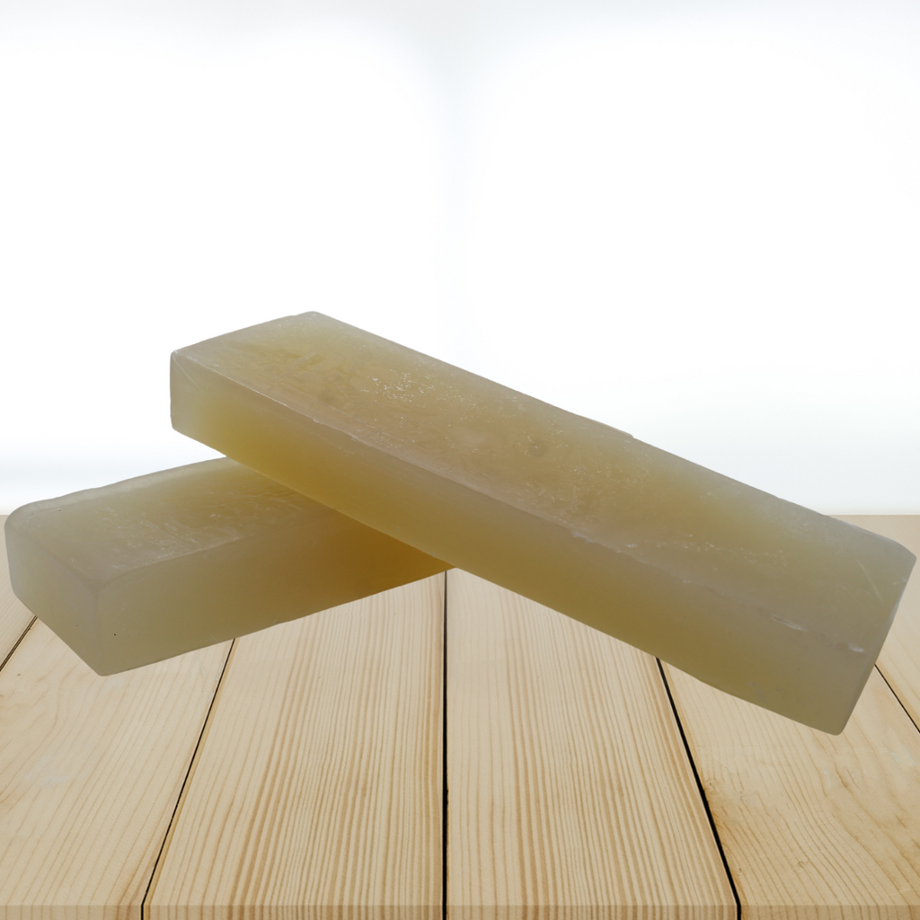 glycerin soap base on a wooden surface with a white background
